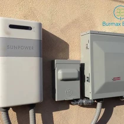 SunPower monitoring equipment and electrical disconnect mounted on an exterior wall